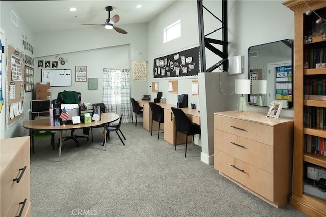 office with ceiling fan, light colored carpet, and lofted ceiling