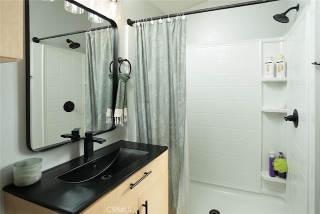 bathroom with vanity and curtained shower