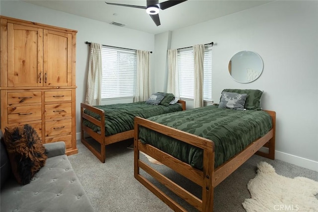 bedroom featuring ceiling fan and light colored carpet