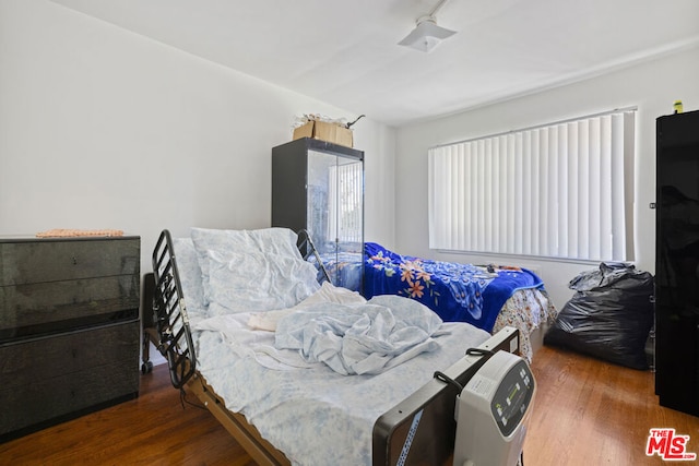 bedroom featuring dark hardwood / wood-style floors