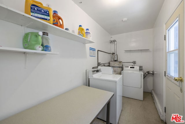 laundry room featuring separate washer and dryer