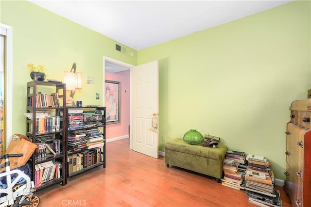 miscellaneous room featuring hardwood / wood-style flooring