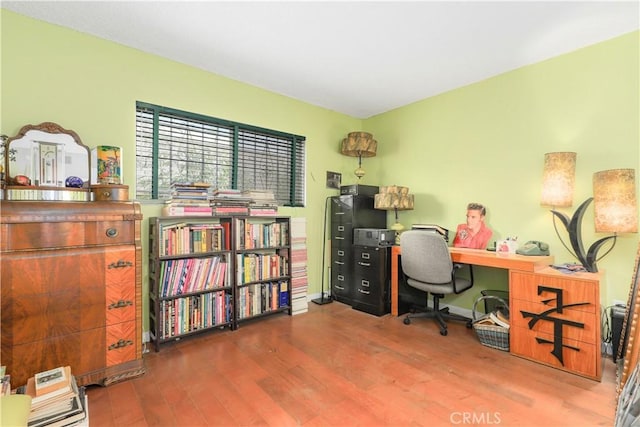 home office with wood-type flooring