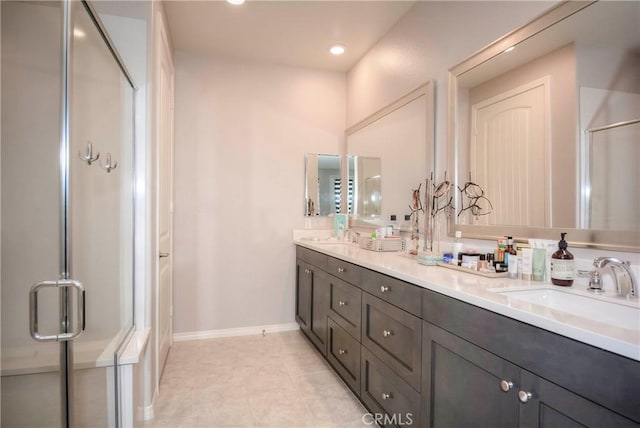 bathroom with vanity, tile patterned floors, and walk in shower