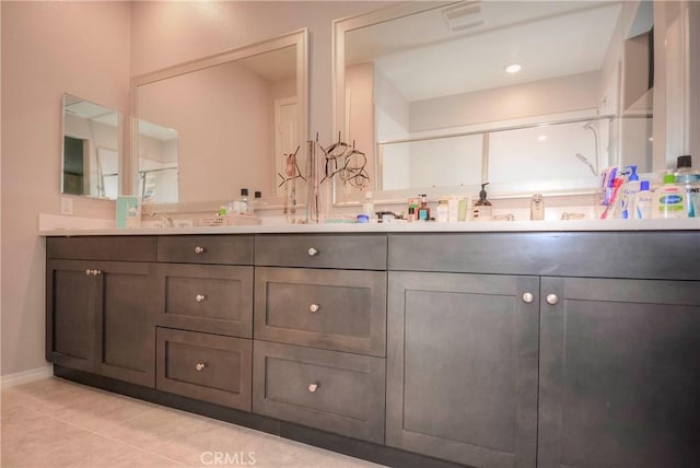 bathroom featuring tile patterned flooring and vanity