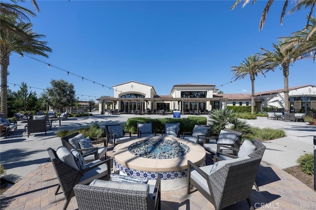 view of patio / terrace with an outdoor fire pit