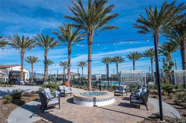 view of patio featuring an outdoor fire pit