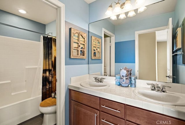 full bathroom featuring tile patterned flooring, vanity, toilet, and shower / bath combo with shower curtain