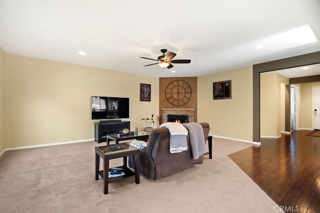 living room with ceiling fan and hardwood / wood-style floors