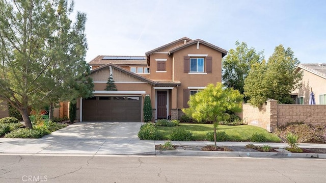 craftsman-style home with solar panels and a garage