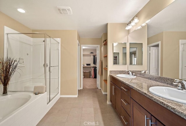 bathroom with tile patterned floors, vanity, and independent shower and bath