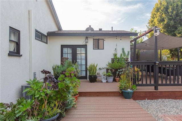 back of house with a wooden deck