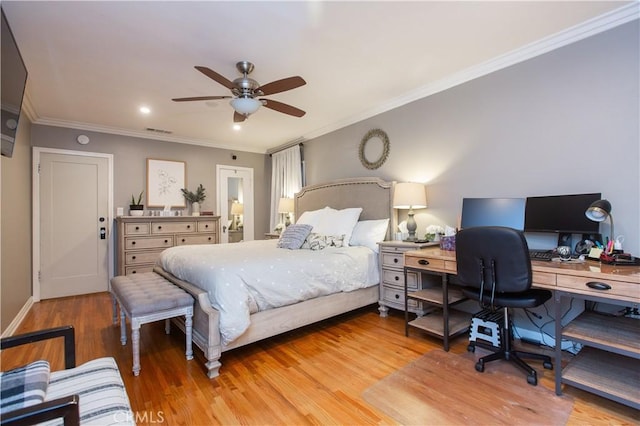 bedroom featuring ceiling fan, light hardwood / wood-style floors, and crown molding