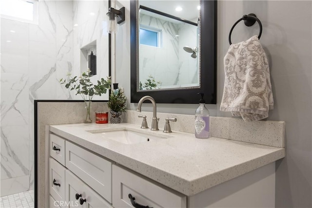 bathroom featuring vanity and walk in shower