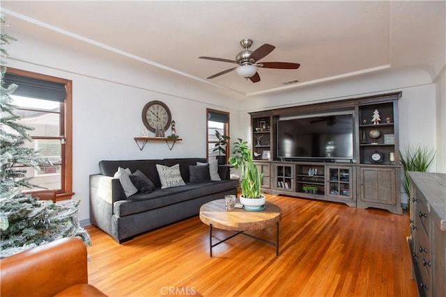 living room featuring ceiling fan and wood-type flooring