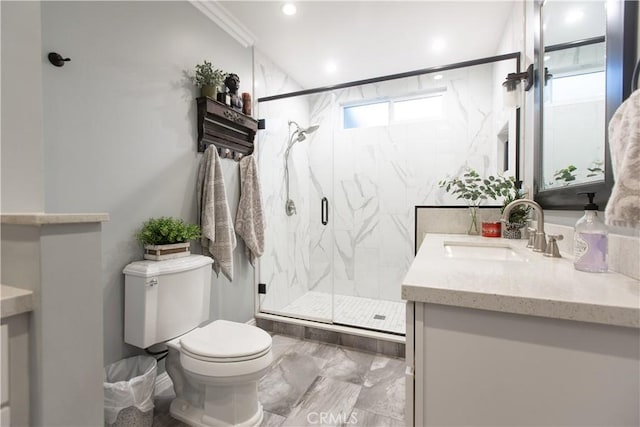 bathroom featuring vanity, toilet, walk in shower, and ornamental molding