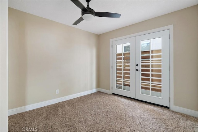 carpeted empty room with ceiling fan and french doors