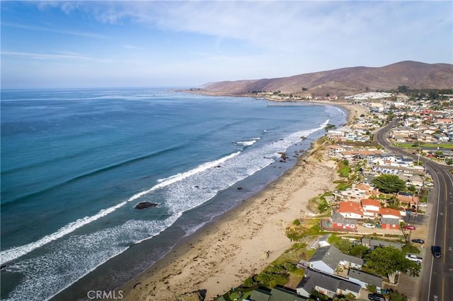 property view of water with a mountain view and a view of the beach