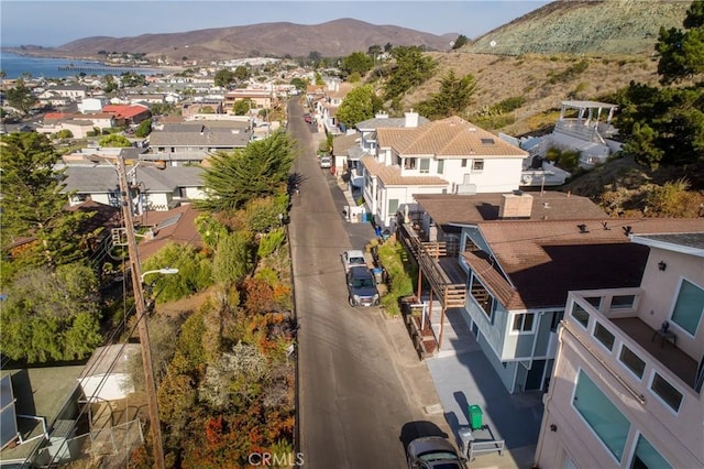 birds eye view of property with a mountain view