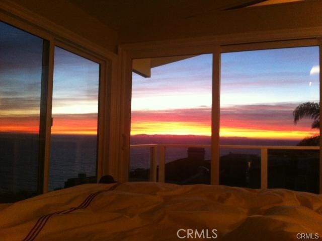 bedroom featuring a water view