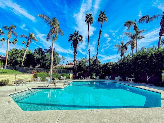 view of swimming pool with a patio