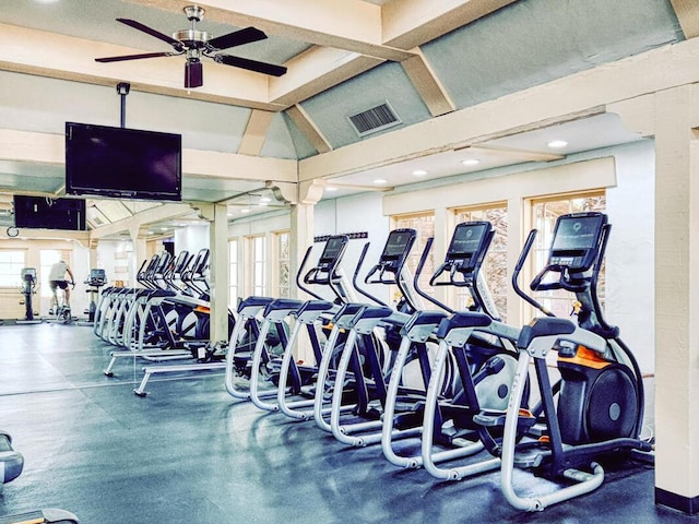 workout area with ceiling fan and lofted ceiling