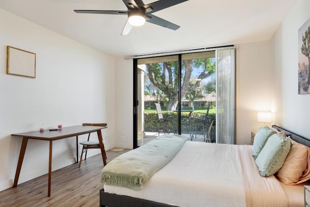 bedroom with hardwood / wood-style flooring, ceiling fan, and access to exterior