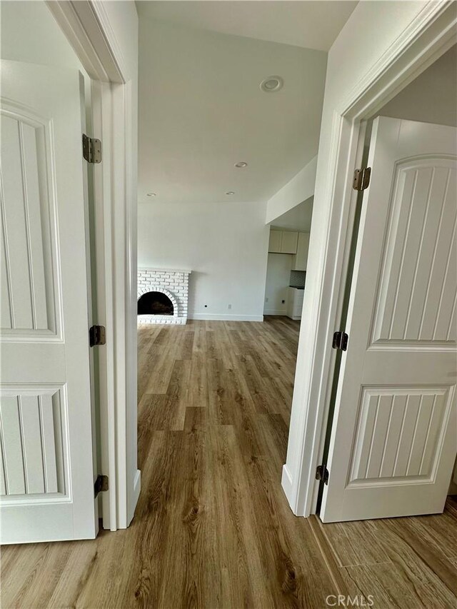 hallway featuring wood-type flooring