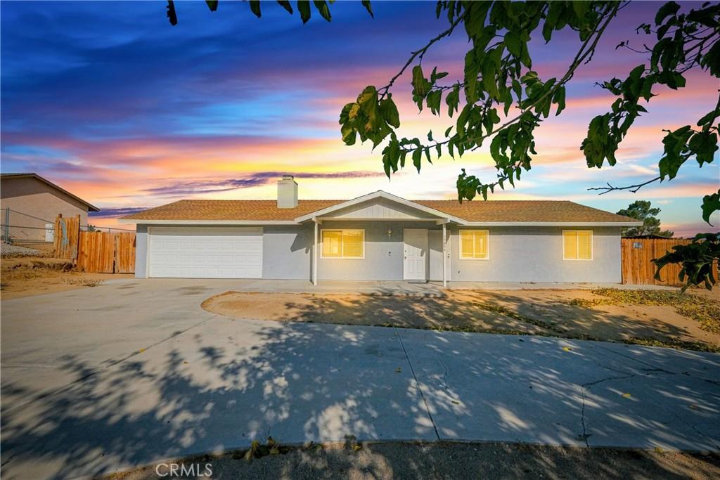 ranch-style house featuring a garage