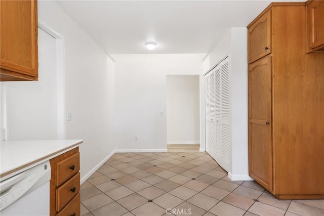 kitchen with dishwasher and light tile patterned flooring