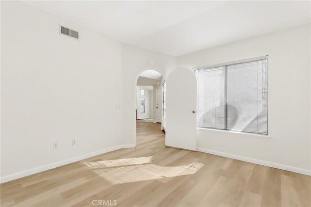 spare room with light wood-type flooring