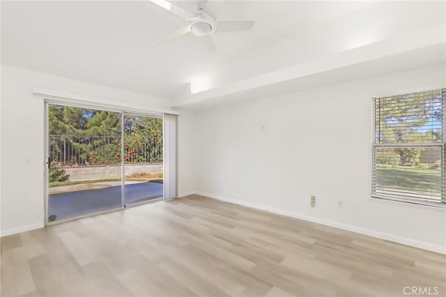 spare room with ceiling fan and light hardwood / wood-style floors