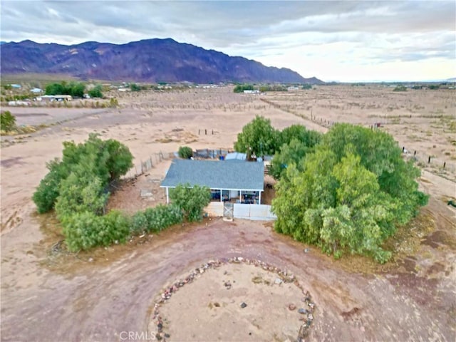 birds eye view of property featuring a mountain view