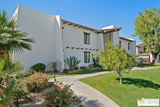 view of front of house with a front lawn