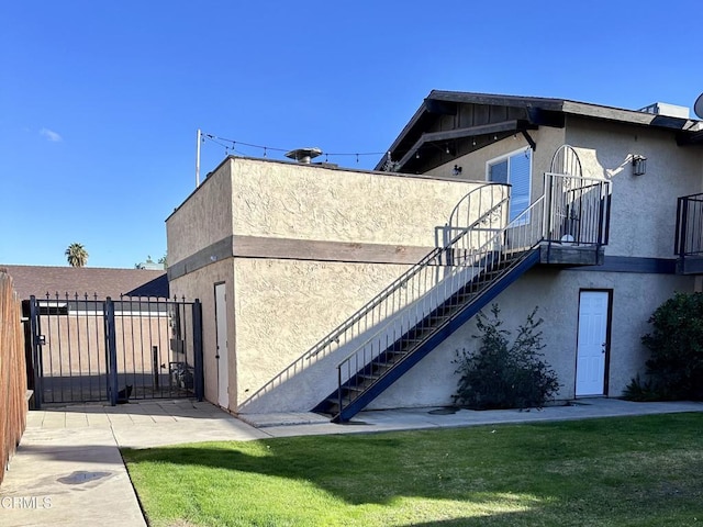 view of side of home featuring a lawn