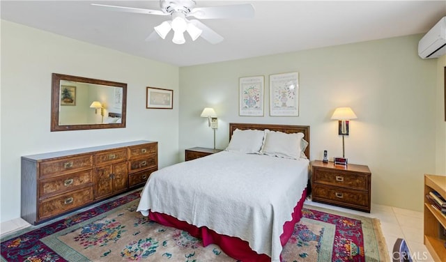 bedroom with ceiling fan, light tile patterned floors, and an AC wall unit