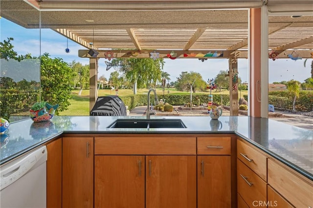 view of patio with sink and a pergola