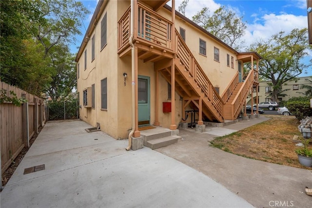 back of property with a balcony