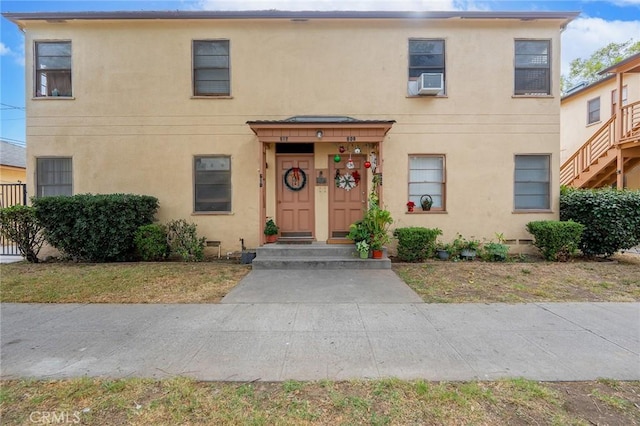 view of front of home featuring cooling unit