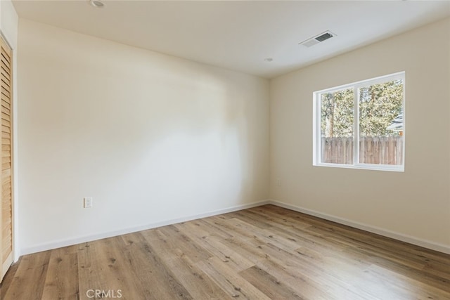 unfurnished room featuring light wood-type flooring