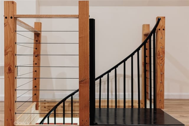 staircase featuring hardwood / wood-style flooring