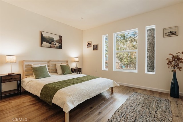 bedroom with wood-type flooring