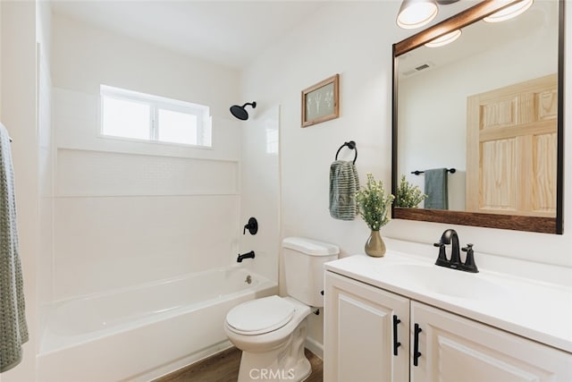 full bathroom with shower / tub combination, hardwood / wood-style floors, vanity, and toilet