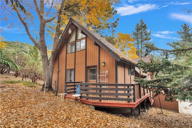 rear view of house with a wooden deck