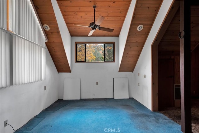 additional living space with wooden ceiling, carpet, lofted ceiling with beams, and ceiling fan