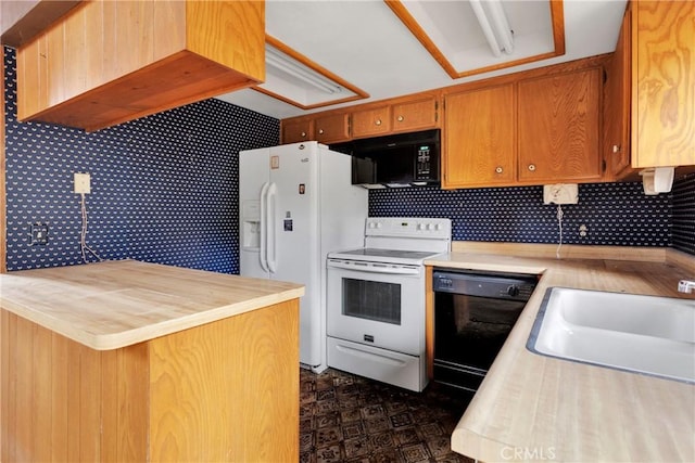 kitchen featuring black appliances and sink