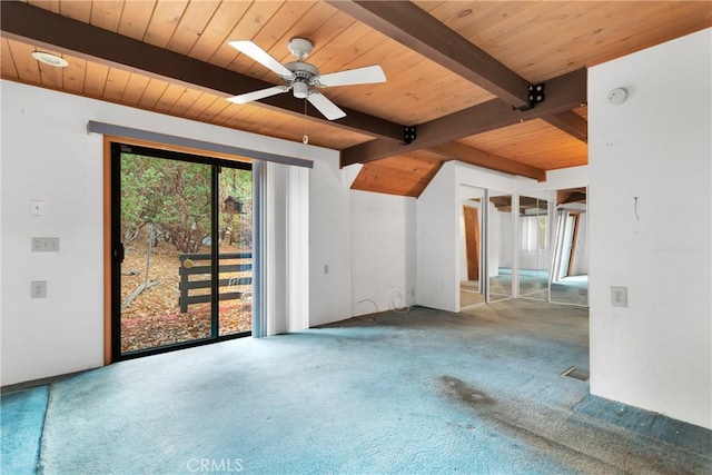 carpeted spare room with ceiling fan, beam ceiling, and wood ceiling