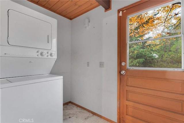 clothes washing area with stacked washer / drying machine, plenty of natural light, and wood ceiling