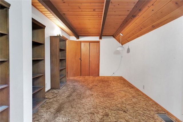 additional living space featuring beam ceiling and wood ceiling