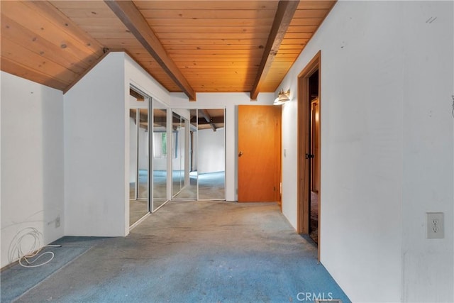 corridor with vaulted ceiling with beams and wood ceiling